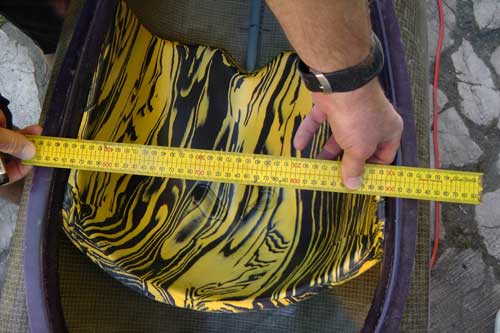 Measuring the width of the kayak cockpit with the Bumfortable in place